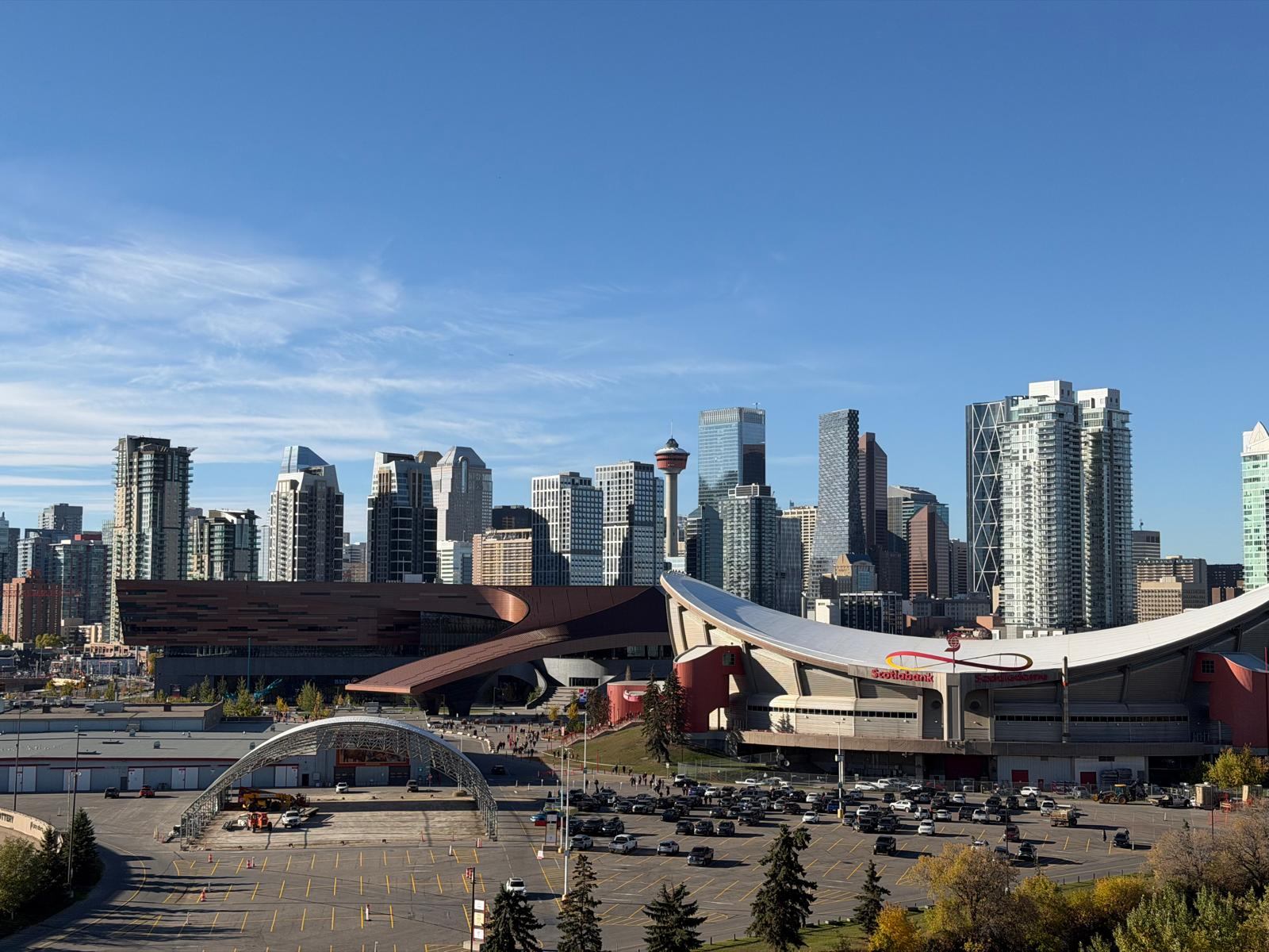 Downtown Calgary skyline with the Calgary Tower above the Scotiabank Saddledome and Stampede Park, seen from Scotsman&rsquo;s Hill