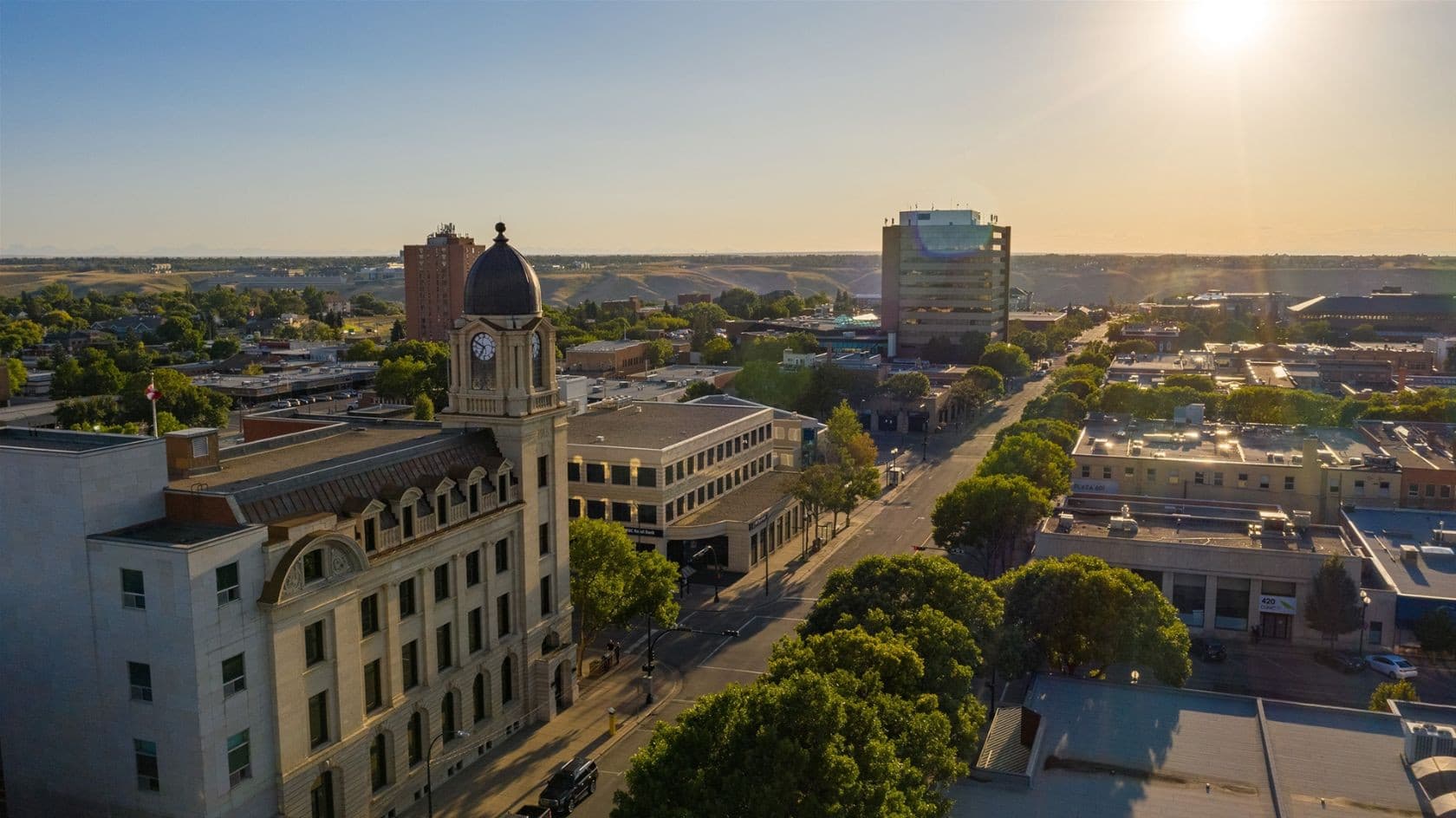 Downtown Lethbridge at sunset with the historic clock tower and office buildings