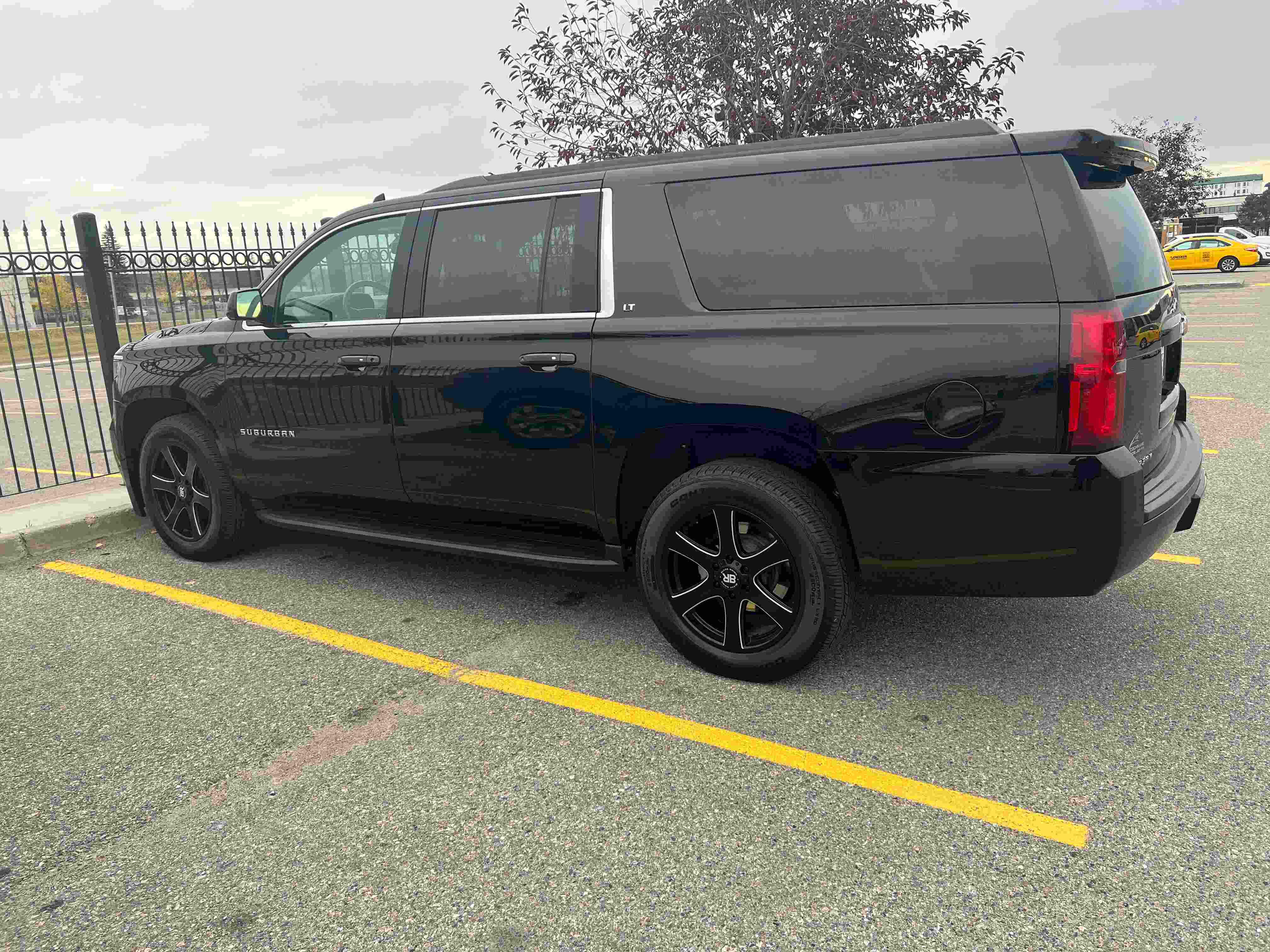 Black Chevrolet Suburban operated by Red Mile Limousine Services