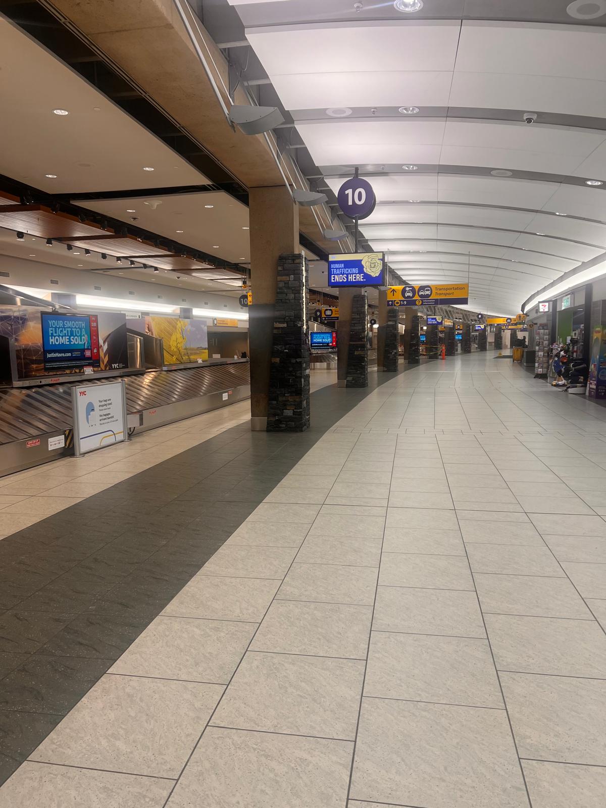 Baggage claim and arrivals hall at Calgary International Airport, where YYC to Lethbridge private transfers begin